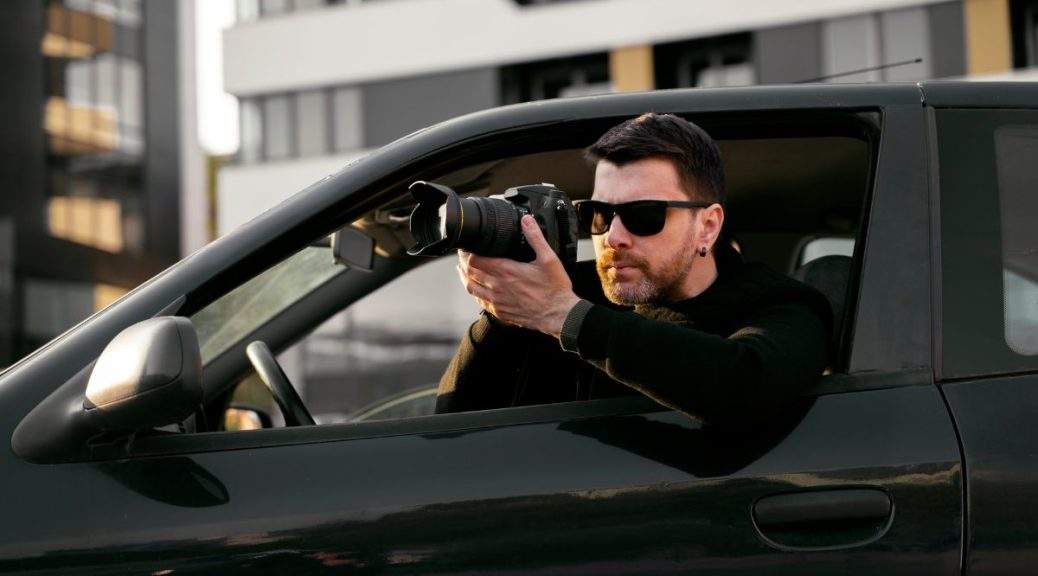 A private detective in Sydney conducting surveillance, holding a camera.